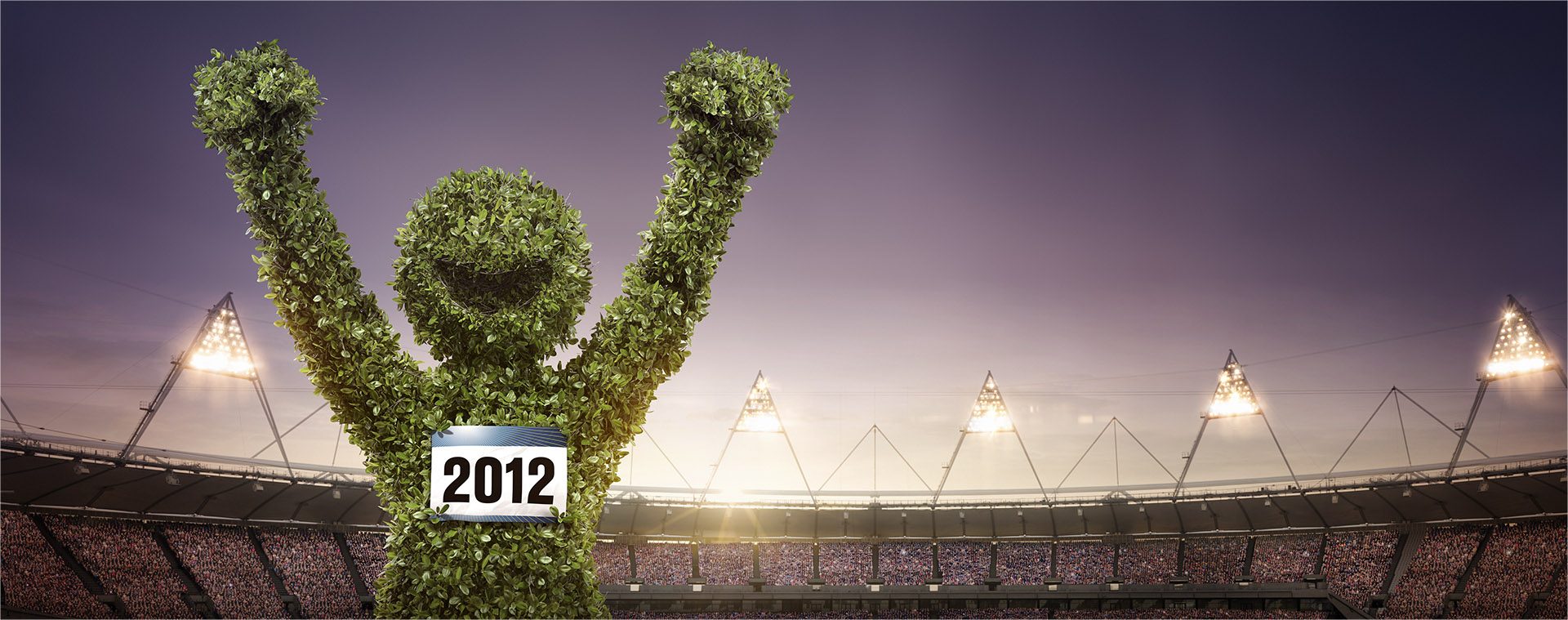 DOW Olympics: a cheering CGI figure made of leaves in an Olympic stadium under floodlights