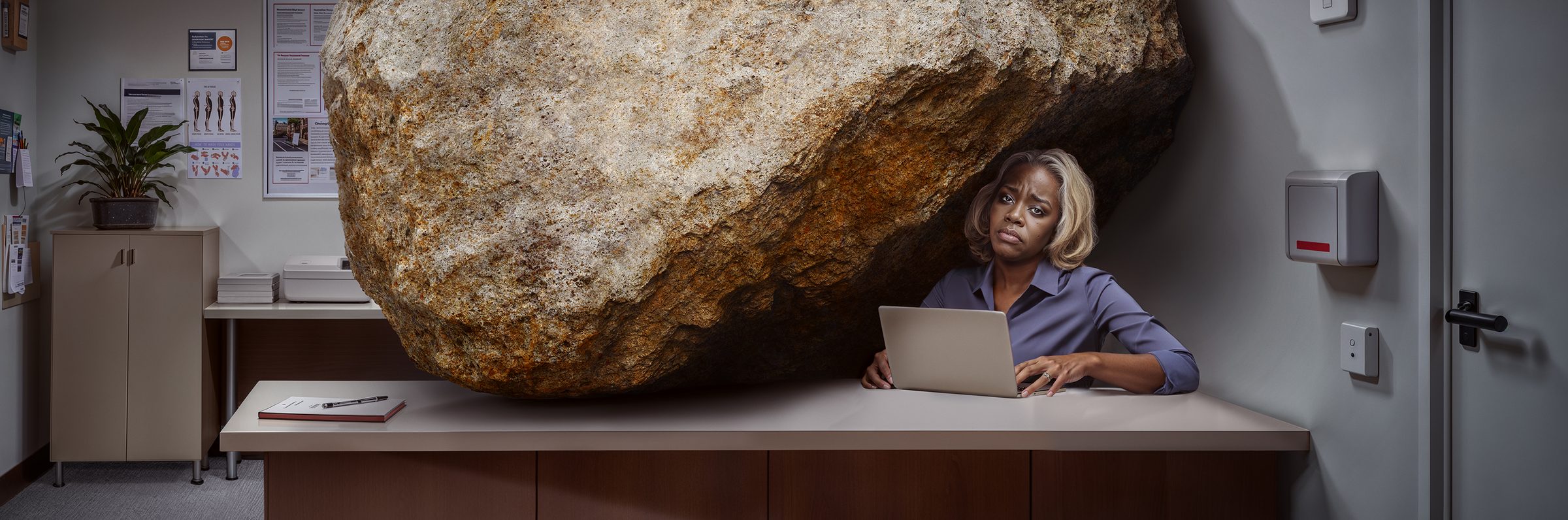 Hallmark A.i: wide crop of the boulder pressing on the desk