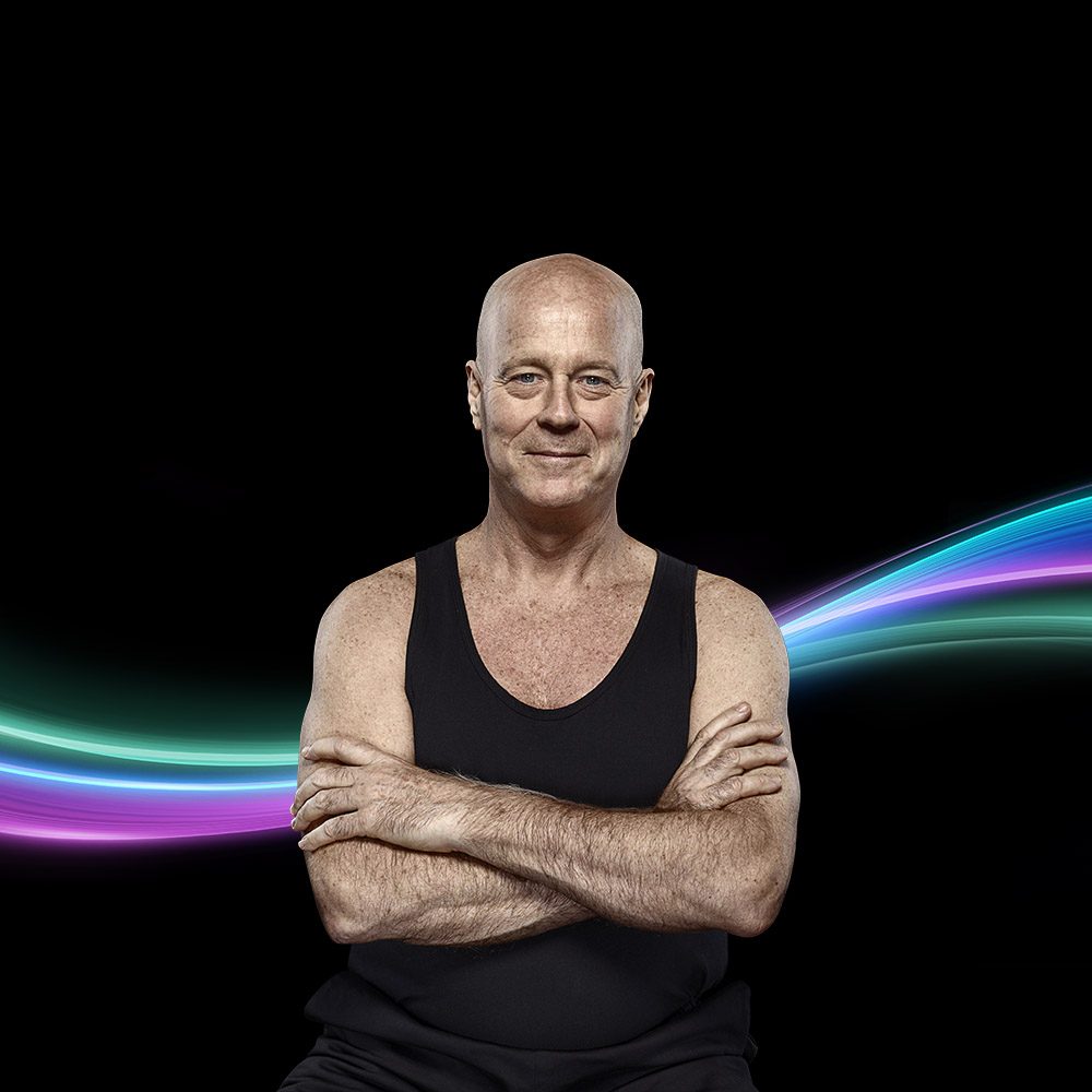 Picato Train: a man with folded arms and a light trail behind him