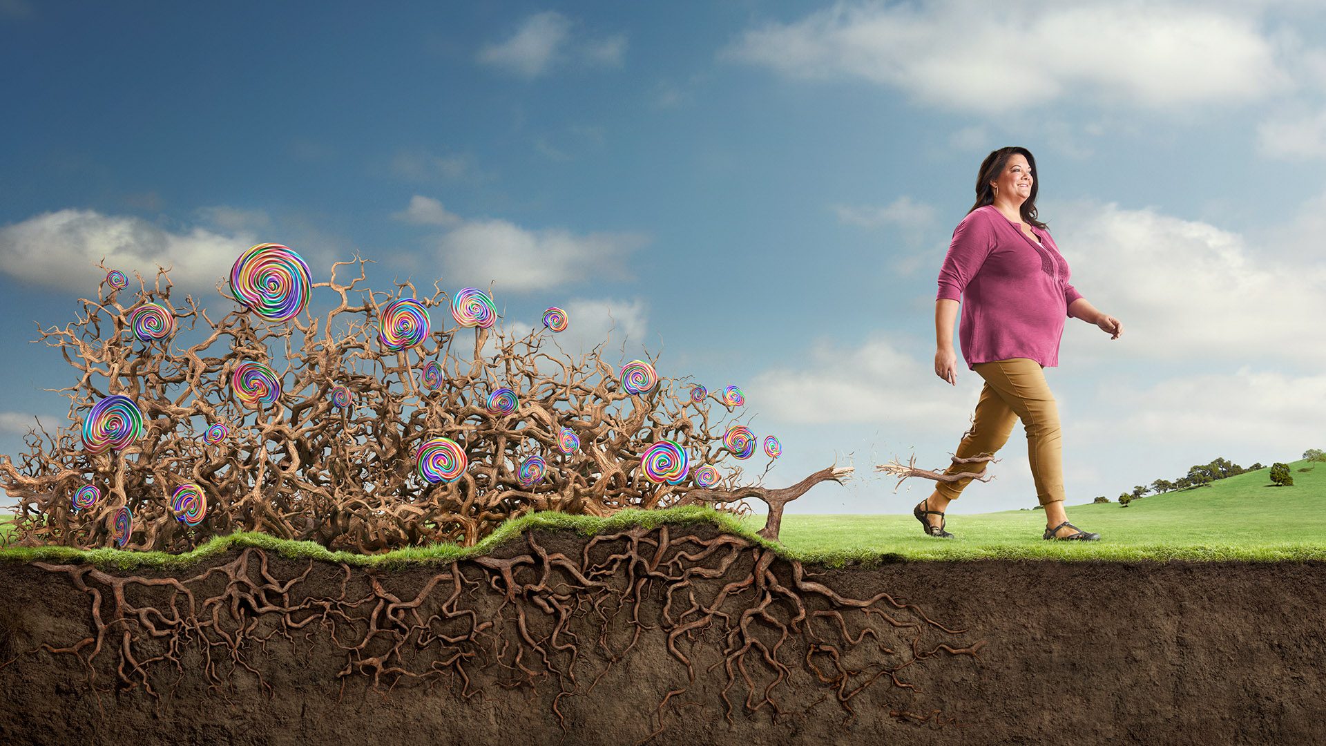 Victoza Roots: a woman walks away from a CGI tangle of roots and swirl lollipops, cut away to show the soil